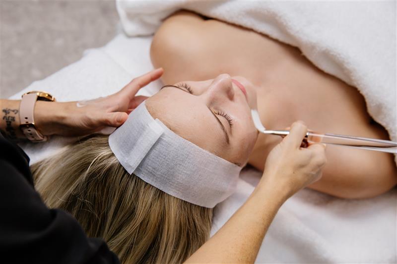 Skincare model receiving facial treatment